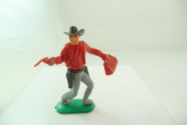 Timpo Toys Cowboy 1. Version stehend mit Pistole + Geldtasche, rot
