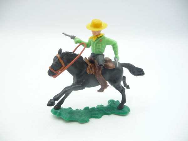Cowboy riding with 2 pistols, neon green