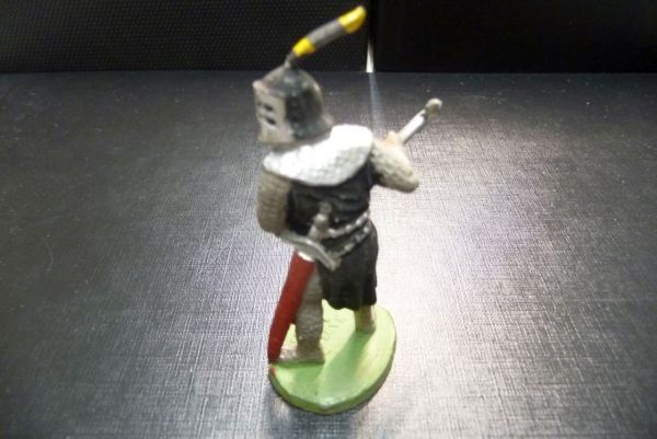 Timpo Toys Knight standing striking with battle axe from side