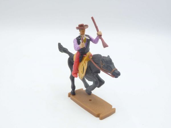 Plasty Cowboy riding with rifle + pistol
