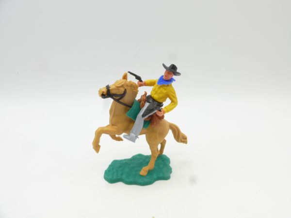 Timpo Toys Cowboy 2. Version reitend, 2 schwarze Pistolen schießend