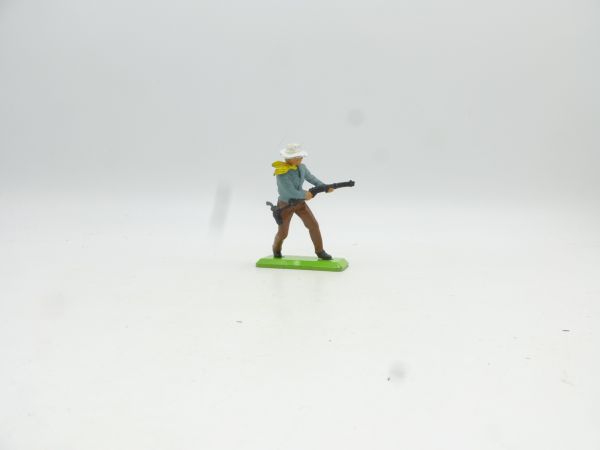 Britains Deetail Cowboy standing, shooting rifle from hip, grey-blue