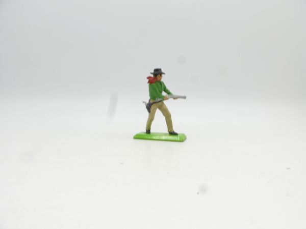 Britains Deetail Cowboy standing, shooting rifle from hip, bottle green