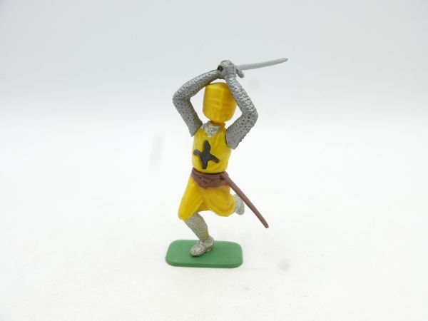 Medieval knight running, sword over head with both hands