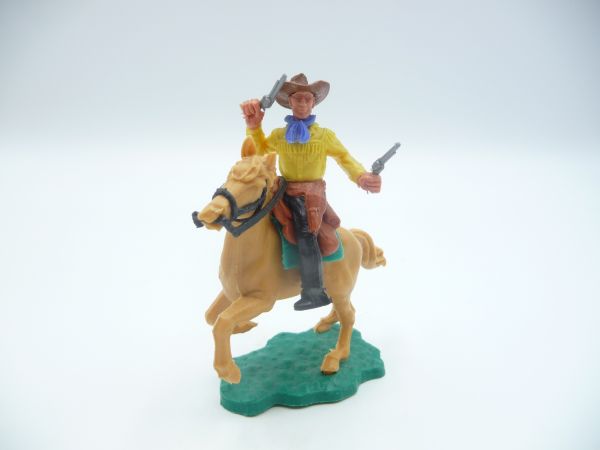 Timpo Toys Cowboy 2nd version riding, firing wild with 2 pistols