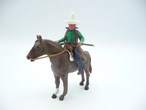 Britains Swoppets Cowboy on horseback, rifle in front of his body