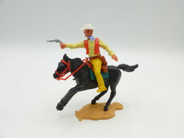 Timpo Toys Cowboy 3. Version reitend, Pistole schießend - tolle Farbkombi