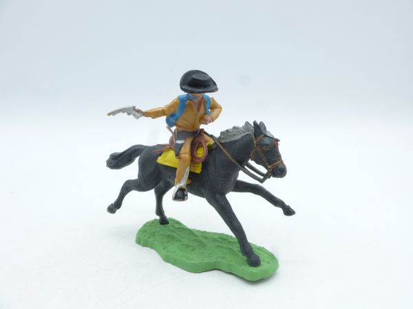 Britains Swoppets Cowboy riding, shooting pistol to the rear