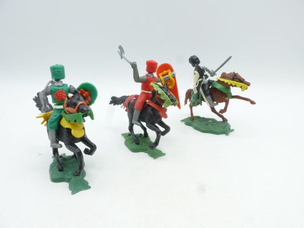 3 medieval knights on horseback (green, red, black)