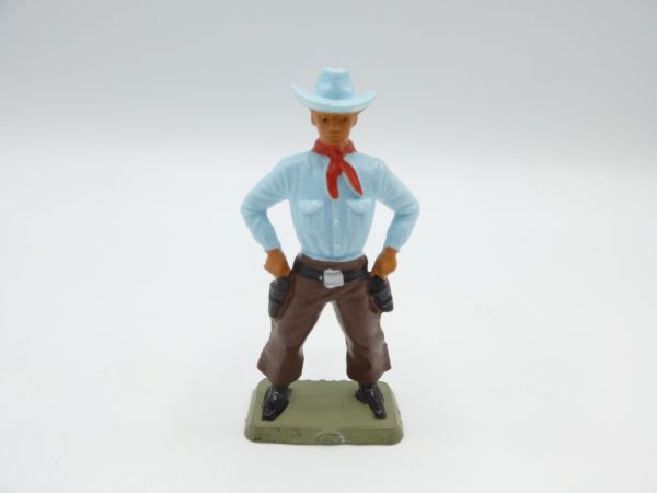 Starlux Cowboy standing, both hands on the pistols