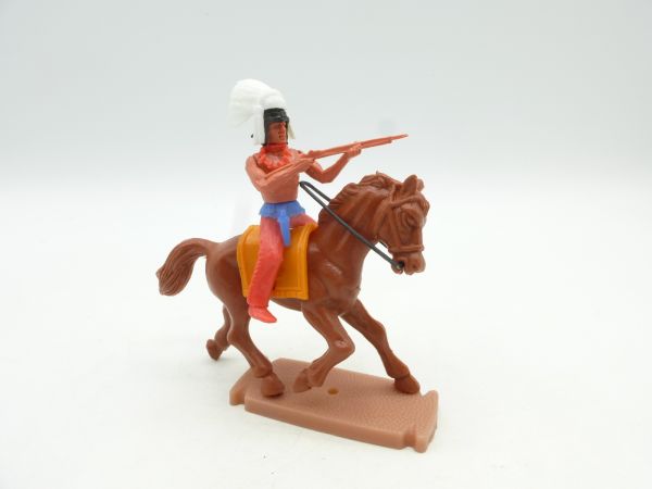 Plasty Indian on horseback, shooting rifle