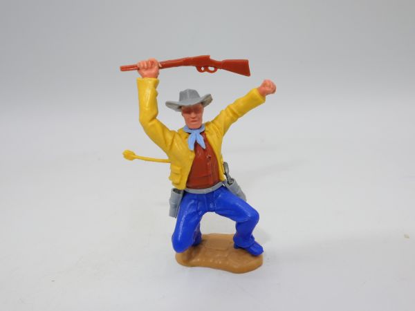 Timpo Toys Cowboy 3. Version hockend, von Pfeil getroffen, gelbe Jacke