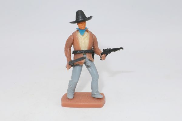 Plasty Cowboy stehend mit Stetson, Gewehr + Pistole