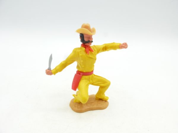 Timpo Toys Cowboy 3. Version hockend mit Messer - tolle Farbkombi