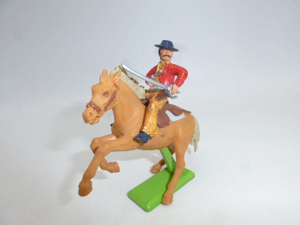 Britains Deetail Mexican riding, sabre at side, pistol in front of chest