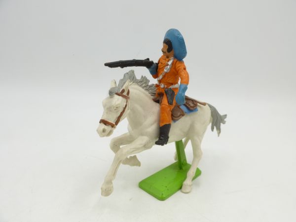 Britains Deetail Mexican on horseback, rifle under arm (orange/blue)