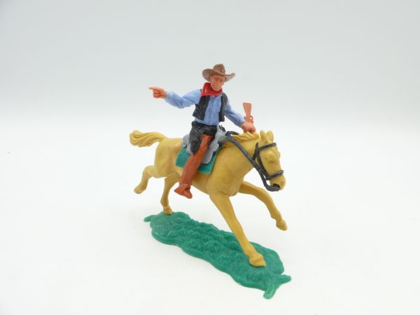 Timpo Toys Cowboy riding with rifle, pointing