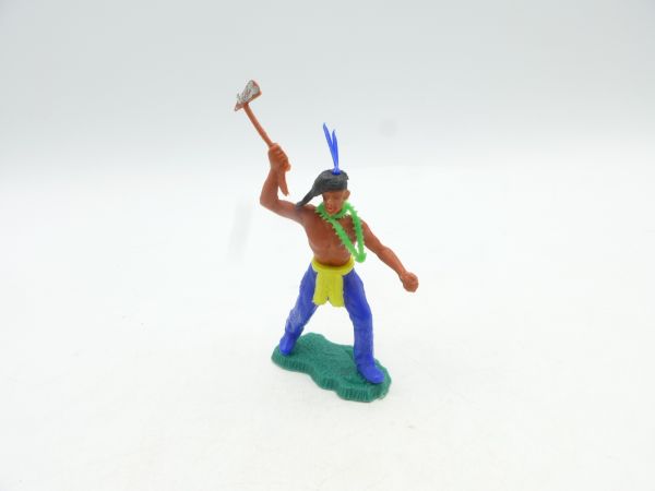 Lone Star Indian standing, holding tomahawk above