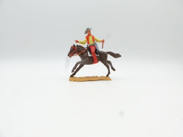 Timpo Toys Cowboy 2nd version riding with rifle + pistol, pointing
