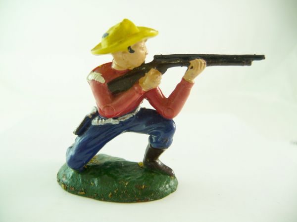 Reisler Cowboy kneeling firing with rifle