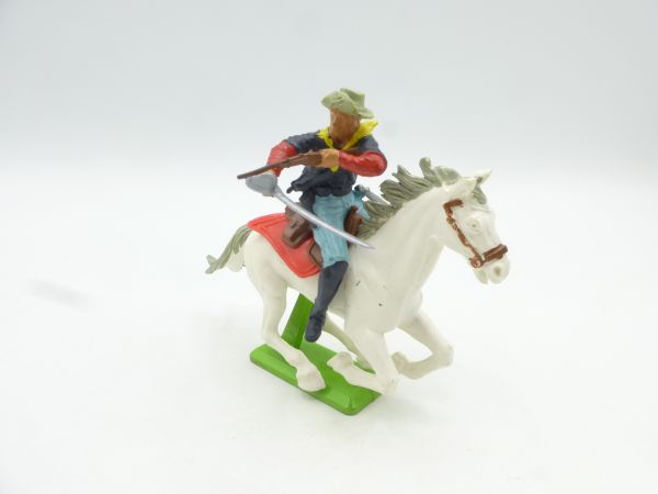 Britains Deetail Soldier 7th cavalry riding with sabre, firing rifle