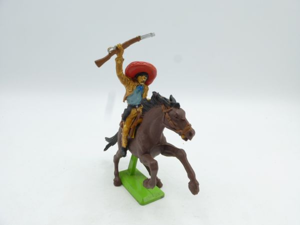 Britains Deetail Mexican riding, shooting pistol, holding rifle on top