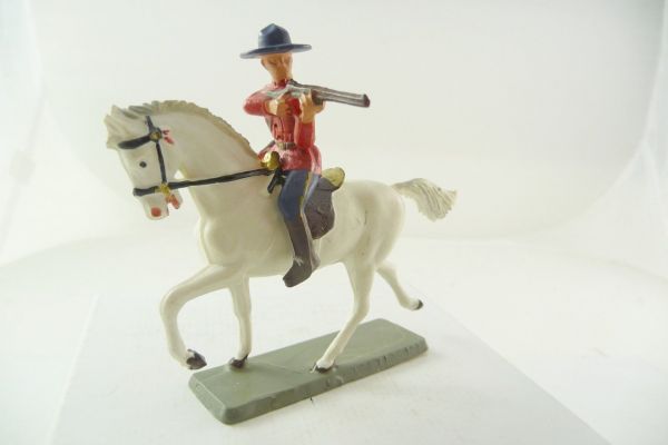 Starlux Mountie riding, firing with rifle, No. 4011