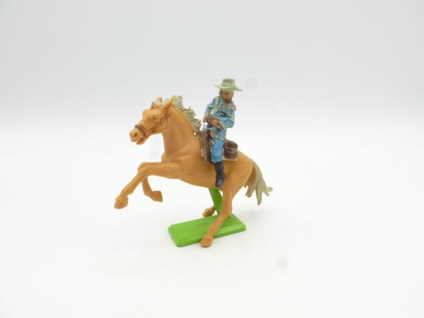 Britains Deetail Cowboy riding, rifle in front of body