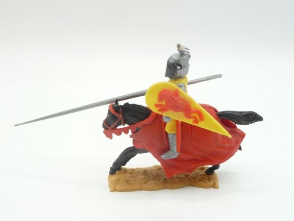 Timpo Toys Visor knight / tournament knight riding with grey tournament lance, yellow/red