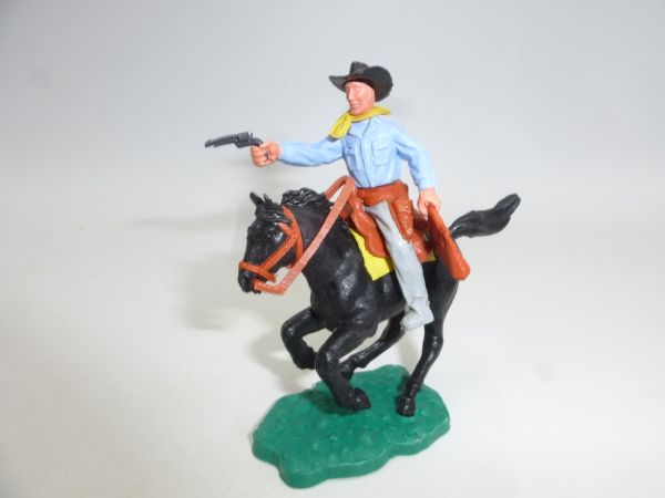Timpo Toys Cowboy 2. Version reitend mit Pistole + Geldtasche