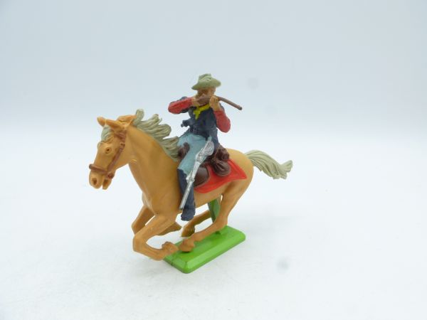 Britains Deetail Soldier 7th cavalry riding, firing rifle sideways