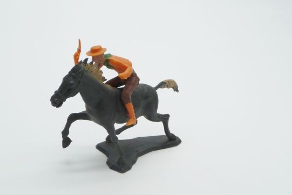 Dulcop Cowboy riding with pistol