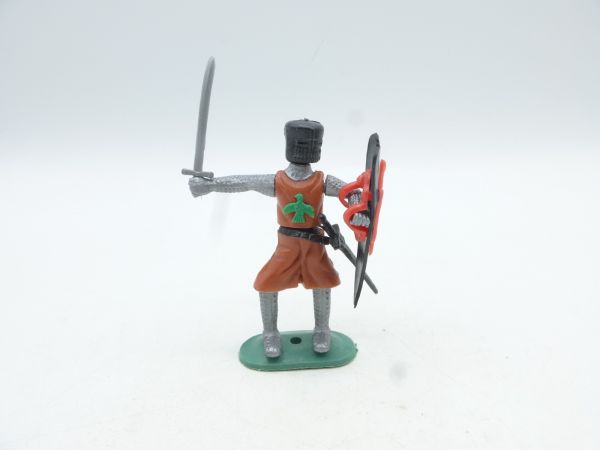 Medieval knight standing with sword, brown
