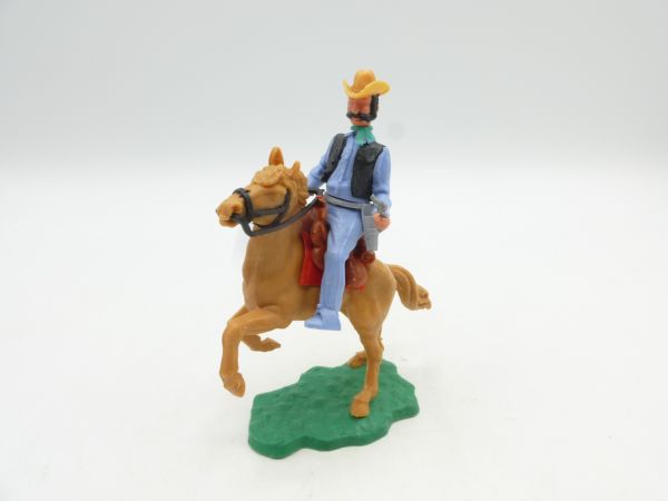 Timpo Toys Cowboy reitend mit 2 Pistolen, auf aufsteigendem Pferd