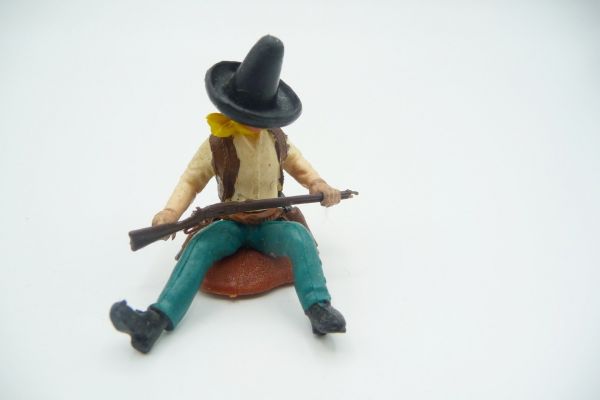 Britains Swoppets Mexican sitting with rifle, beige shirt