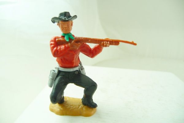 Timpo Toys Cowboy 3. Version hockend, Gewehr schießend