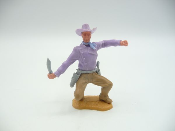 Timpo Toys Cowboy 2. Version hockend mit Messer - schönes fliederfarbenes Oberteil