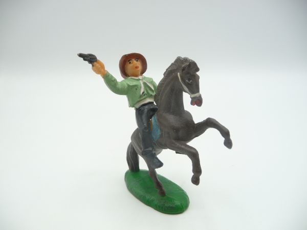 Cowboy riding, firing pistol - rare colour