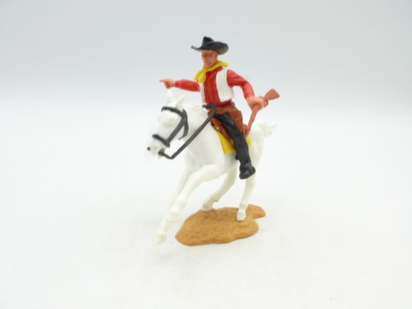 Timpo Toys Cowboy riding with rifle, pointing sideways
