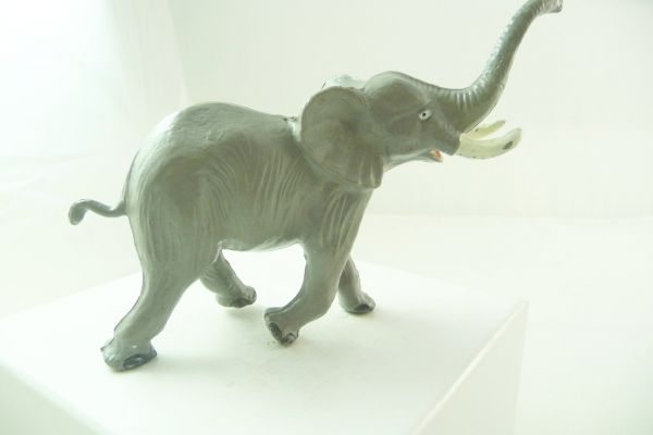 Reisler Elephant running, trunk high