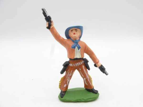 Cowboy standing, shooting wild with 2 pistols