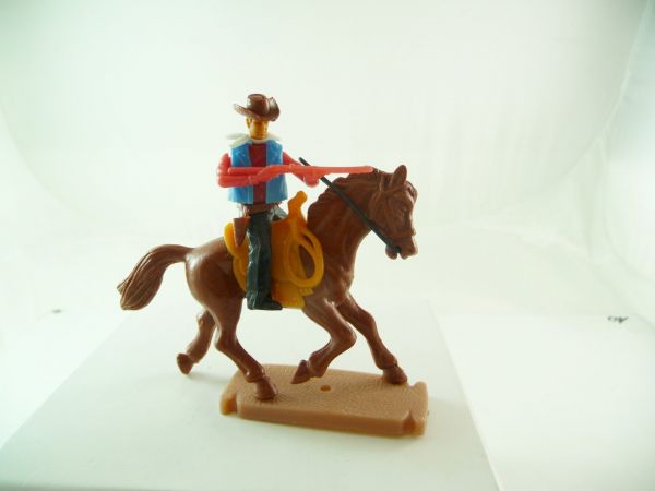 Plasty Cowboy riding firing with rifle