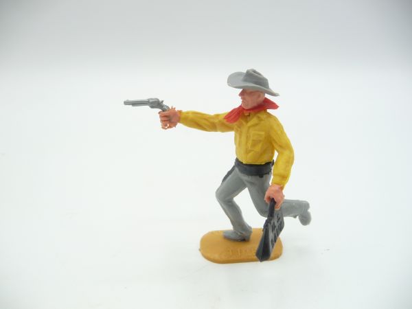 Timpo Toys Cowboy 2nd version running with pistol + money bag