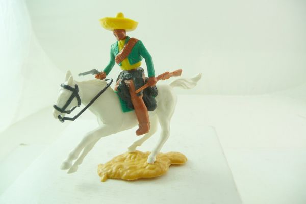Timpo Toys Mexikaner reitend, grün/gelb mit Pistole + Gewehr