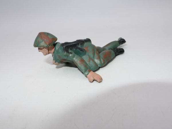 Soldier (camouflage spot uniform) crawling