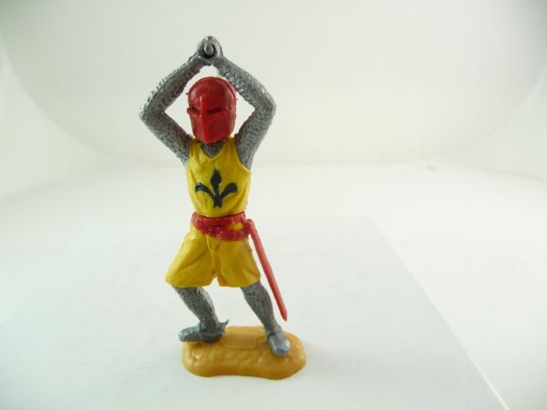 Timpo Toys Medieval knight striking with sword ambidextrous over head, yellow/red