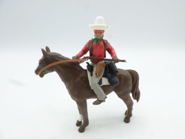 Britains Swoppets Cowboy riding, rifle in front of his body