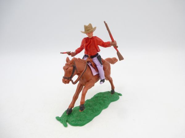 Timpo Toys Cowboy 1. Version (rot) reitend mit Gewehr + Pistole