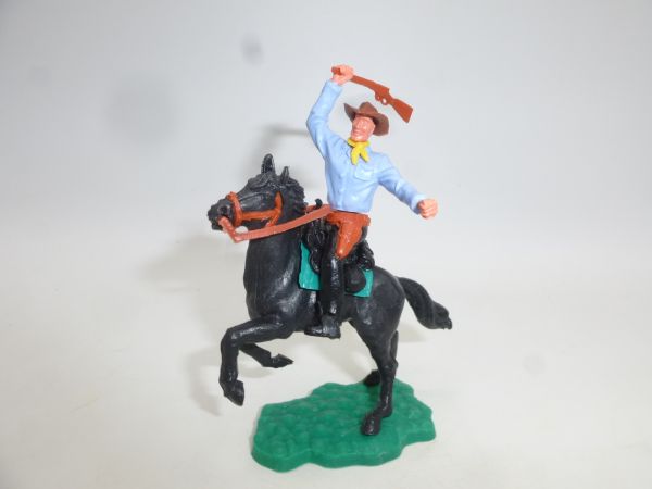 Timpo Toys Cowboy 2nd version riding, striking with rifle
