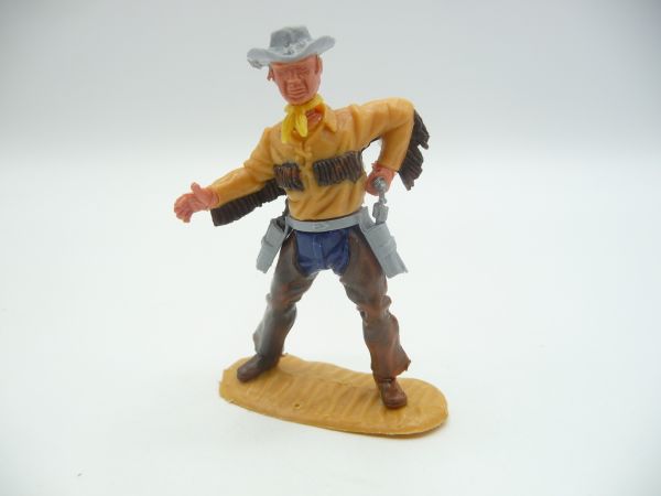 Timpo Toys Cowboy 4th version with fringed shirt + chaps, pulling pistol